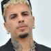 Rauw Alejandro durante una presentación; el cantante enfrenta rumores sobre un supuesto nacimiento de su primer hijo, información que aún no confirma.